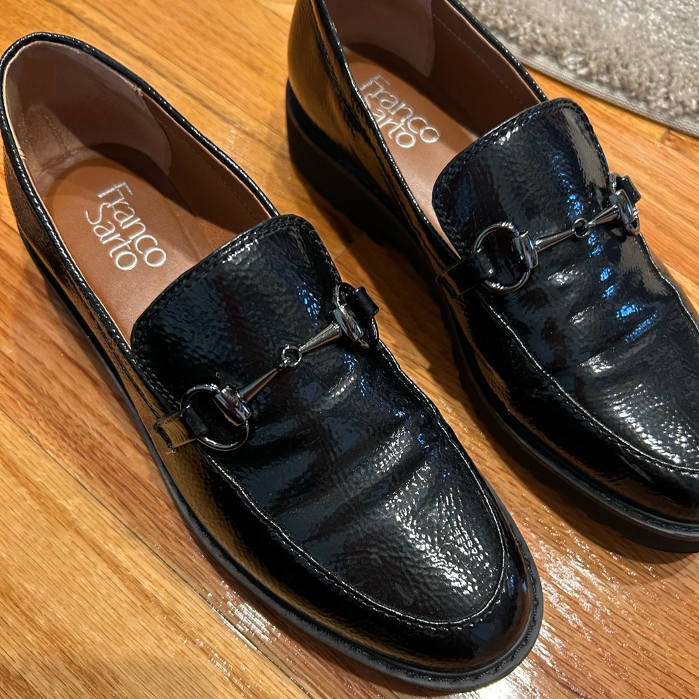 Franco Sarto Black Patten Leather Slip In shoe with rubber sole. Size 6.5